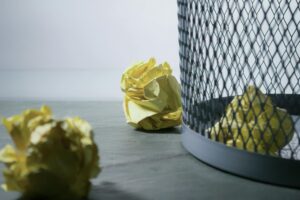 Photo by Steve Johnson: https://www.pexels.com/photo/focus-photo-of-yellow-paper-near-trash-can-850216/